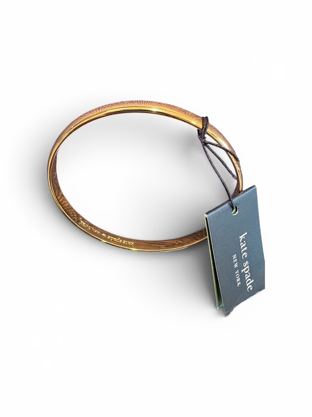 kate spade Gold Tone Signature Engraved Bangle
